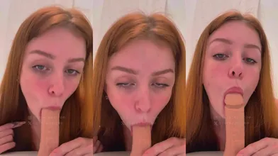 Sara Apollo chupando uma pica de borracha